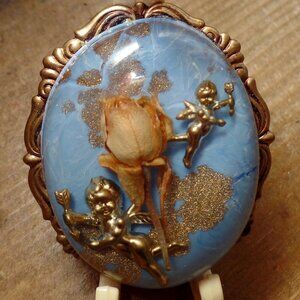 Vintage Cupid And Dry Flower Brooch